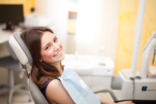 Smiling woman sitting in a dental chair